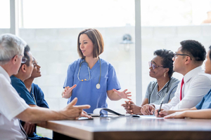 Doctor talking in a meeting